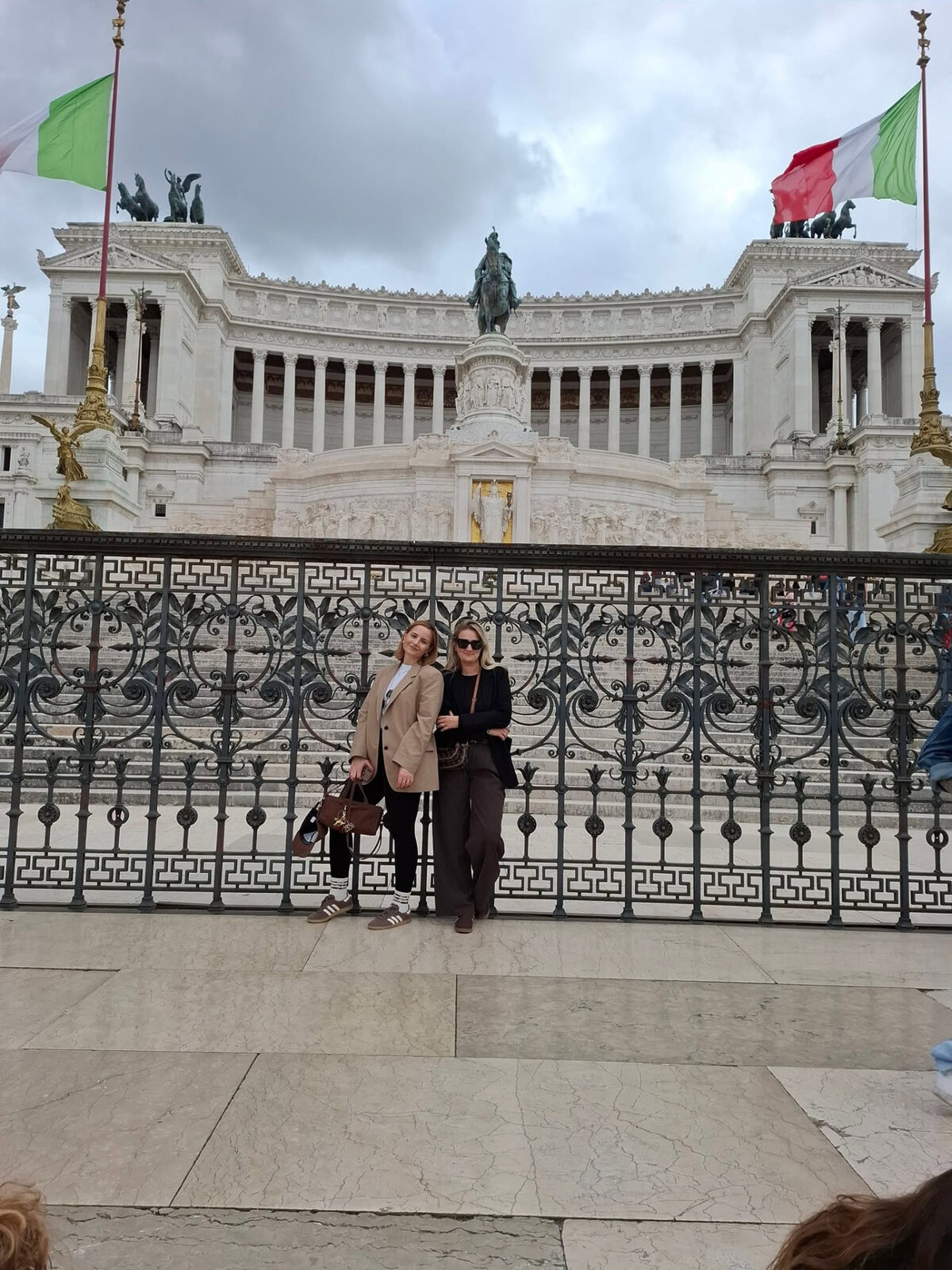 Two members on a cultural study visit in front of a monumental building