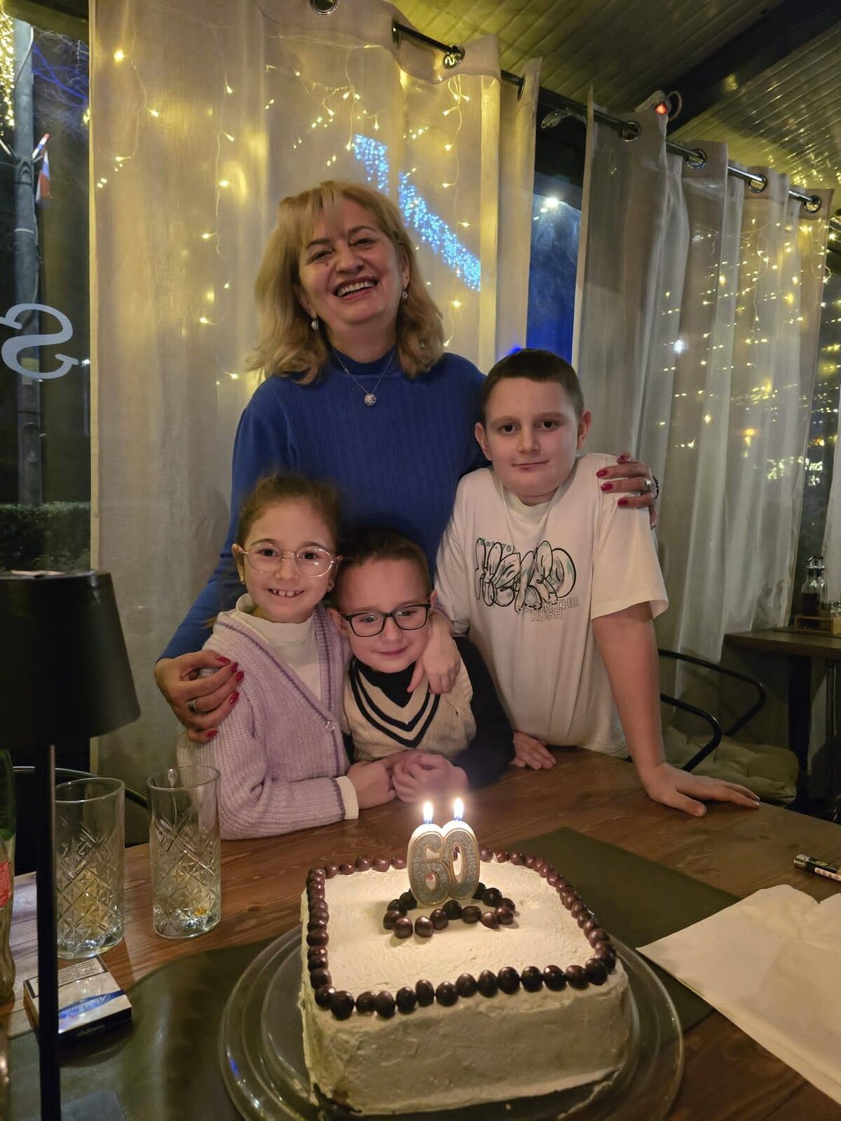A family gathered around a table celebrating together